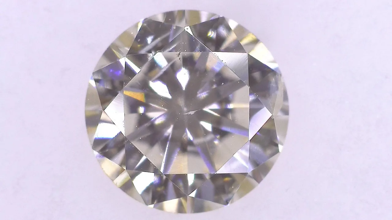 0.715 CT K） 淡棕色 SI-2 良好/GD/GD 中蓝色 天然 5.65-5.67X3.51MM 钻石散装